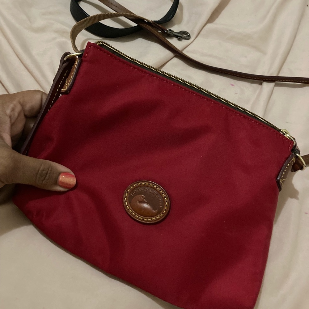 Small, red, Dooney and Burke cross body.